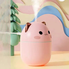 Pink cat-shaped humidifier on a colorful background