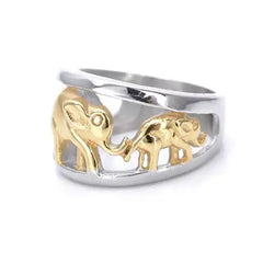 Silver ring with gold elephants on a white background