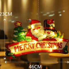 Decorative Christmas ornament with Santa Claus, tree, and snowman, illuminated, with measurements indicated.