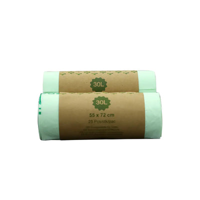 Two rolls of green biodegradable pet waste bags with brown labels on a white background