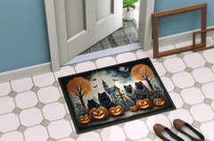 Halloween-themed doormat with Keeshonds, pumpkins, and a haunted church and cemetary design.