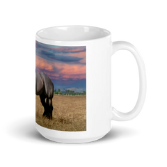 White mug with a horse in a field design on a white background
