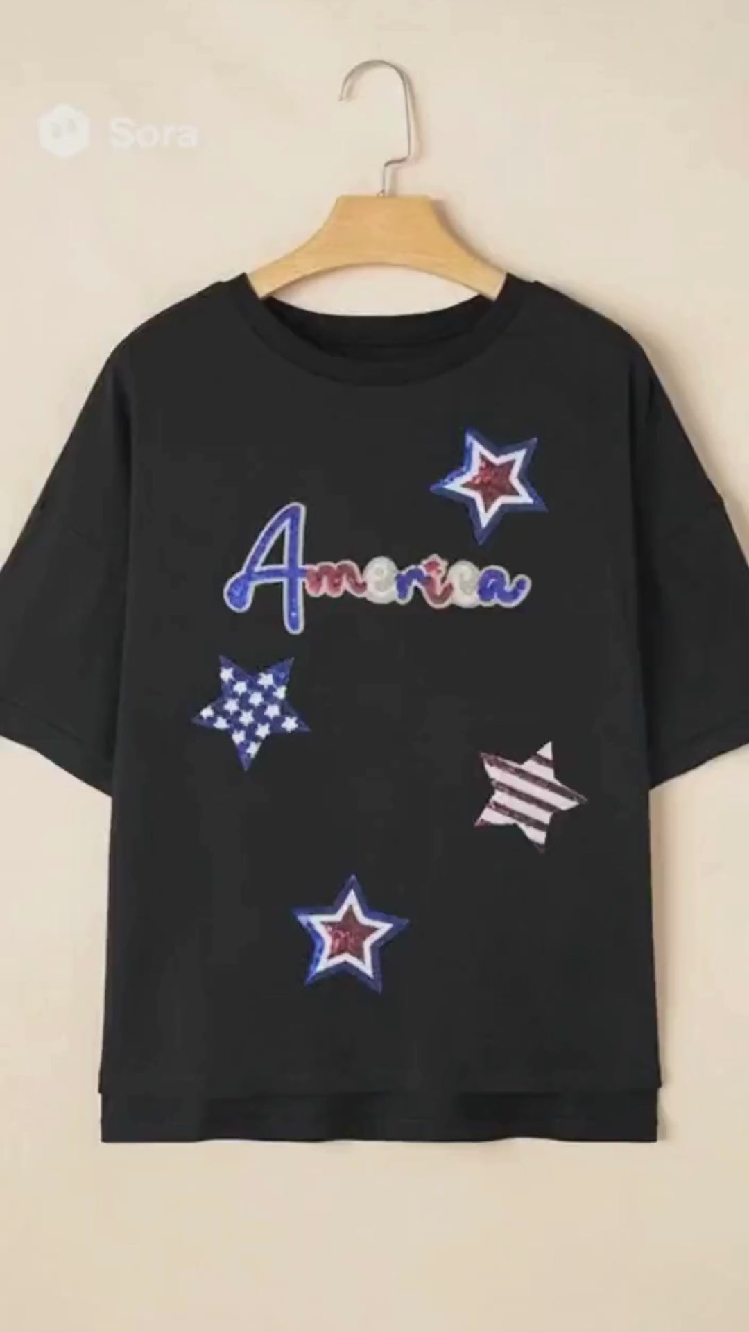 Red headed woman walking down city street wearing the America Tshirt that has red white and blue stars surrounding the word