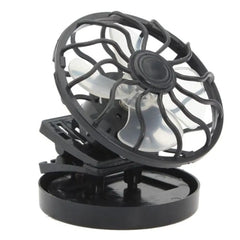 Black portable fan with transparent cage on a white background has clip to mount