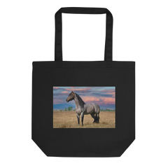 Black tote bag with a horse in a field design on a white background