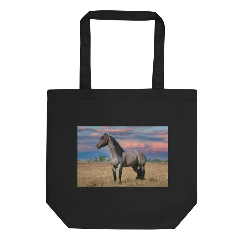 Black tote bag with a horse in a field design on a white background