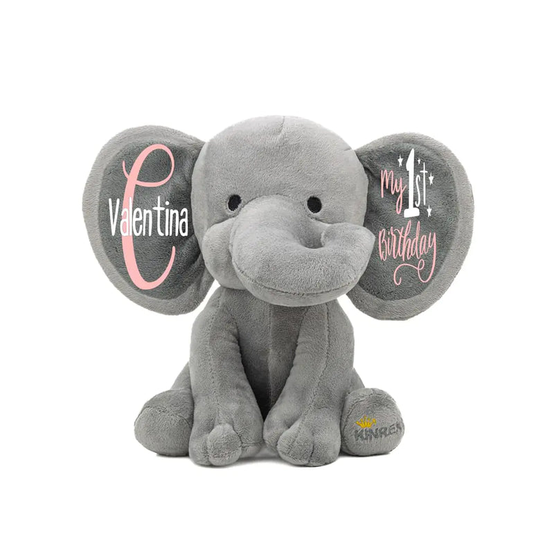Gray elephant plush toy with personalized text on the ears. Baby name on one and my 1st Birthday on the other