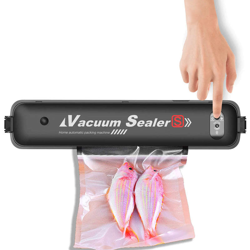 Vacuum sealer with a hand pressing down on it, sealing two fish in a bag.