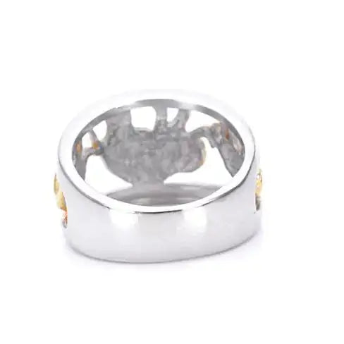 Silver ring with engraved design on a white background