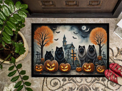 Halloween-themed doormat with Keeshonds, pumpkins, and a haunted church and cemetary design.