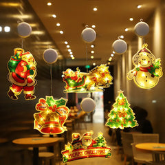 Decorative Christmas lights shaped like Santa Claus, reindeer, and Christmas tree hanging in a restaurant.
